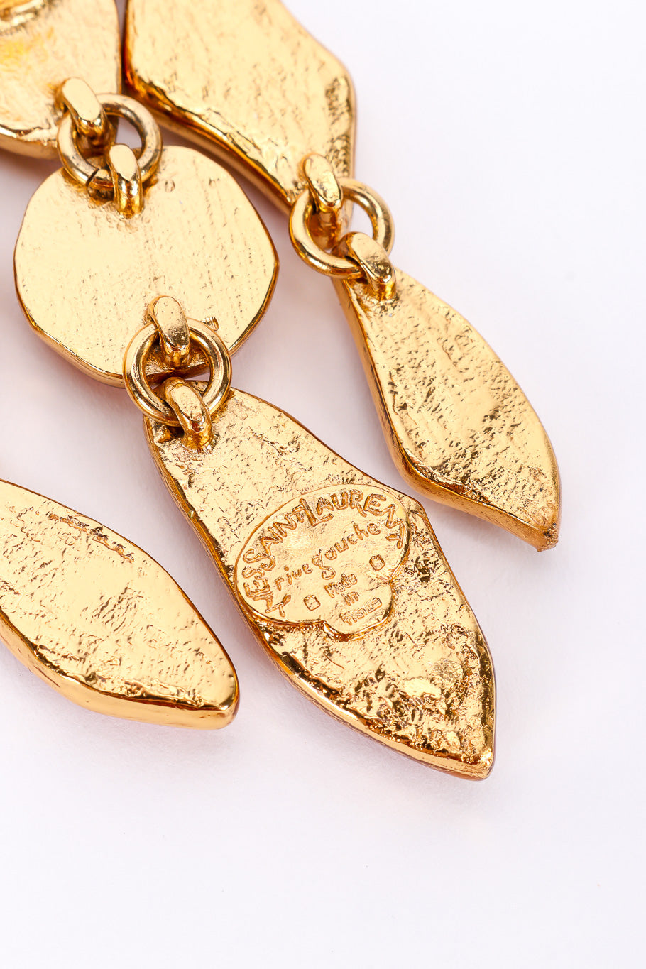 Chandelier earrings by Yves Saint Laurent on white background cartouche close @recessla