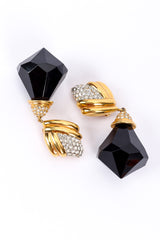 Diamond drop earrings by St. John on white background opposite each other @recessla