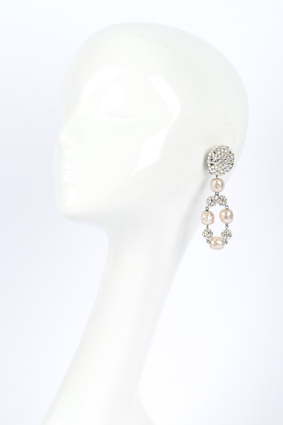 Pearl drop earrings by James Arpad on white background on mannequin head @recessla