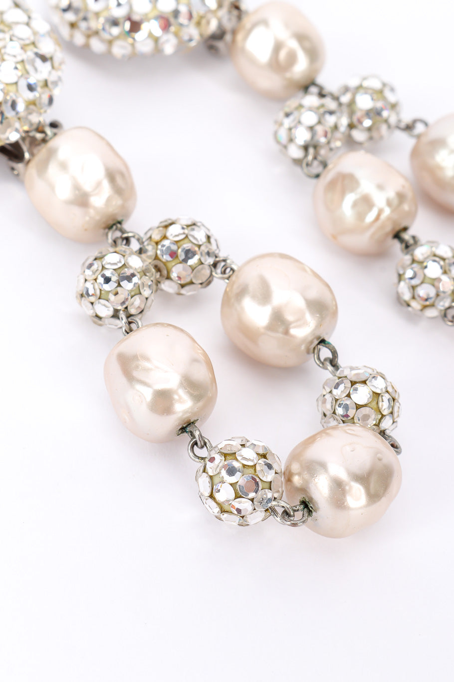 Pearl drop earrings by James Arpad on white background bottoms @recessla