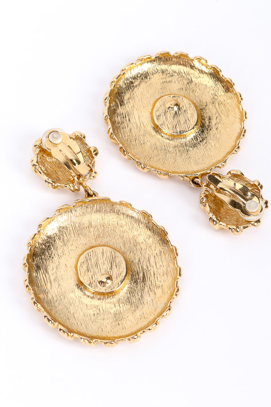 Medallion drop earrings by Givenchy on white background backs @recessla