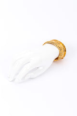 Shiny Sculpted Cuff Bracelet on mannequin wrist far @recessla
