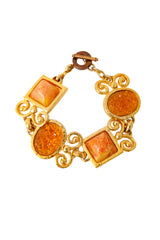 Ornate link bracelet with textured amber-tone glass panels and gold scrollwork by Shadow Paris @ Recess LA
