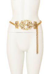 Gold tone chain belt with ornate rose filigree plaque detail on mannequin @ Recess LA
