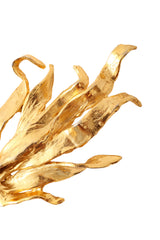 Golden sculptural flame brooch by Linda Hattab up close @ Recess LA