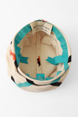 ribbon hat by Yves Saint Laurent inside @ Recess LA