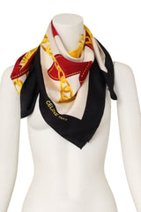 Large silk golden spur ribbon and chain scarf by Celine on mannequin @ Recess LA