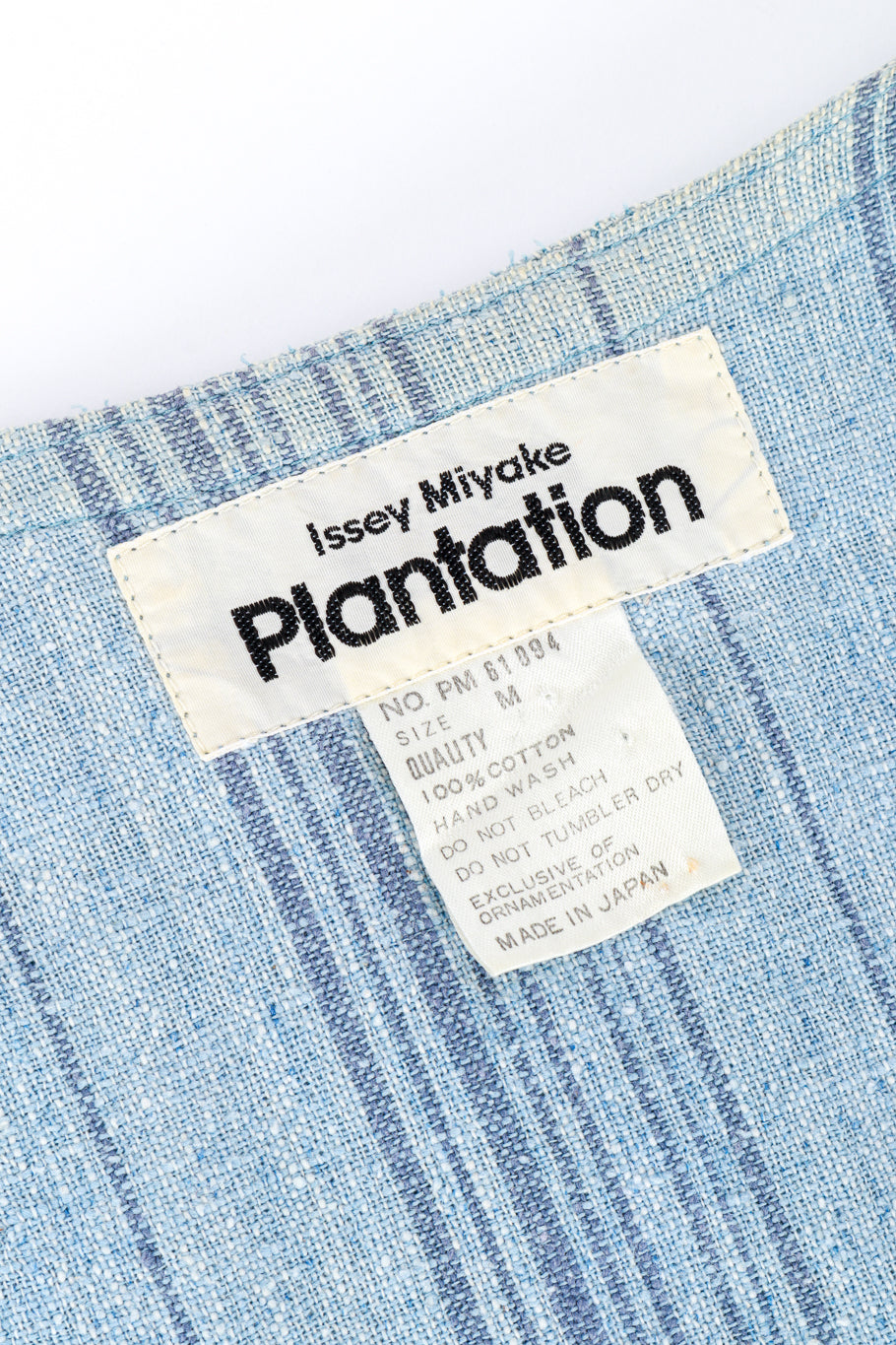 Vintage Issey Miyake plantation raw cotton duster flat lay detail of duster label with makers mark and garment care details @RECESS LA