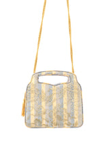 Vintage handbag by Judith Leiber hanging in front of white background @recessla