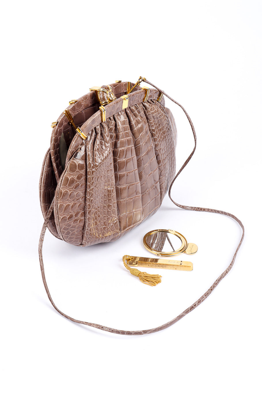 Ruched Alligator Handbag by Judith Leiber standing with mirror and comb  @recessla