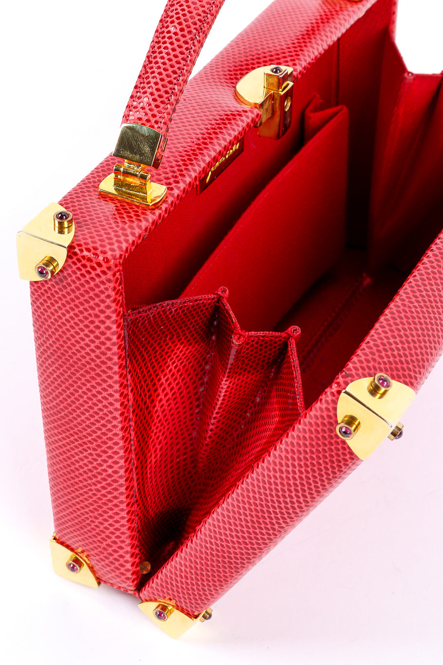 Leather handbag by Judith Leiber hanging open showing inside @recessla