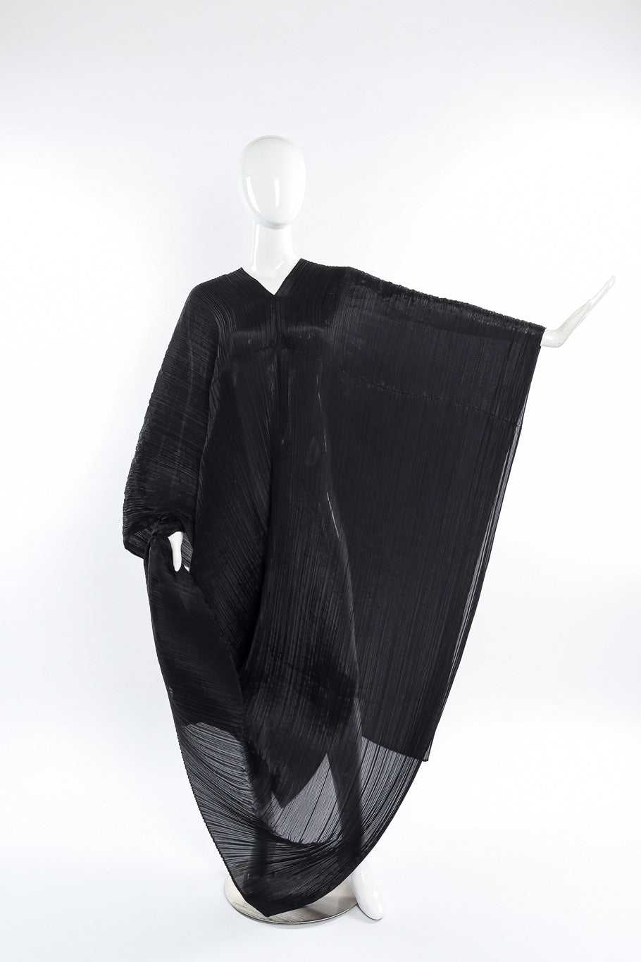 Pleats Please Issey Miyake Pleated Multi-Wrap Poncho II front view on mannequin with left arm extended for sleeve span @Recessla