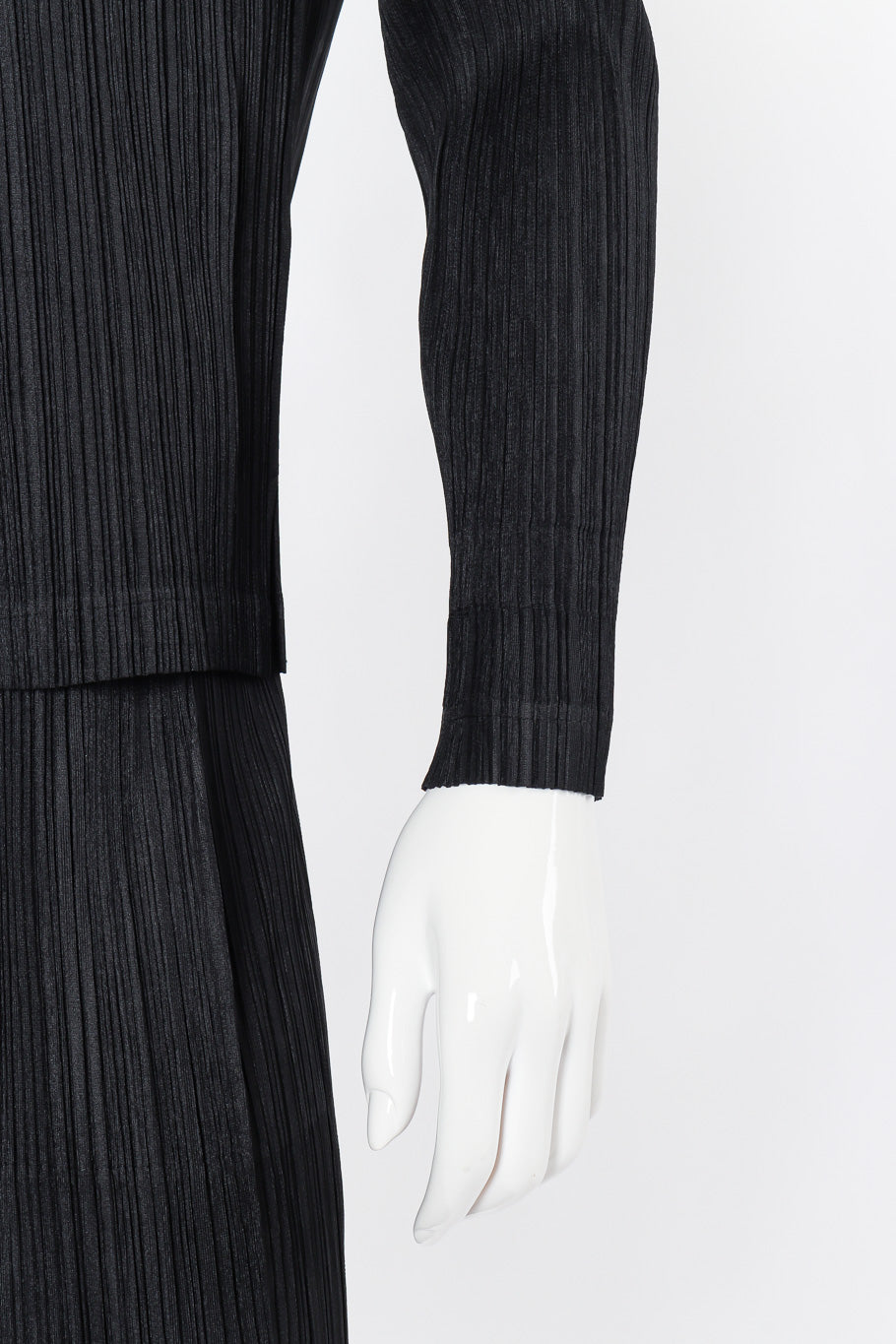 Pleated skirt, top, and jacket set by Issey Miyake on mannequin sleeve close @recessla