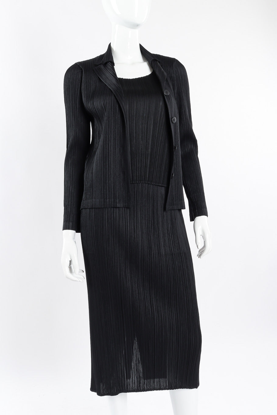Pleated skirt, top, and jacket set by Issey Miyake on mannequin close @recessla