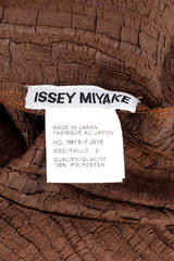 Textured three piece set by Issey Miyake flat lay label @recessla