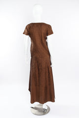 Textured three piece set by Issey Miyake on mannequin back @recessla