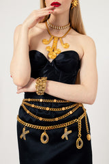 XOXO charm belt by Paloma Picasso on white background on model with other belt @recessla