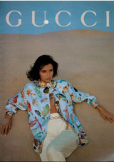 model on beach with same chain link as belt in 1992 Gucci ad