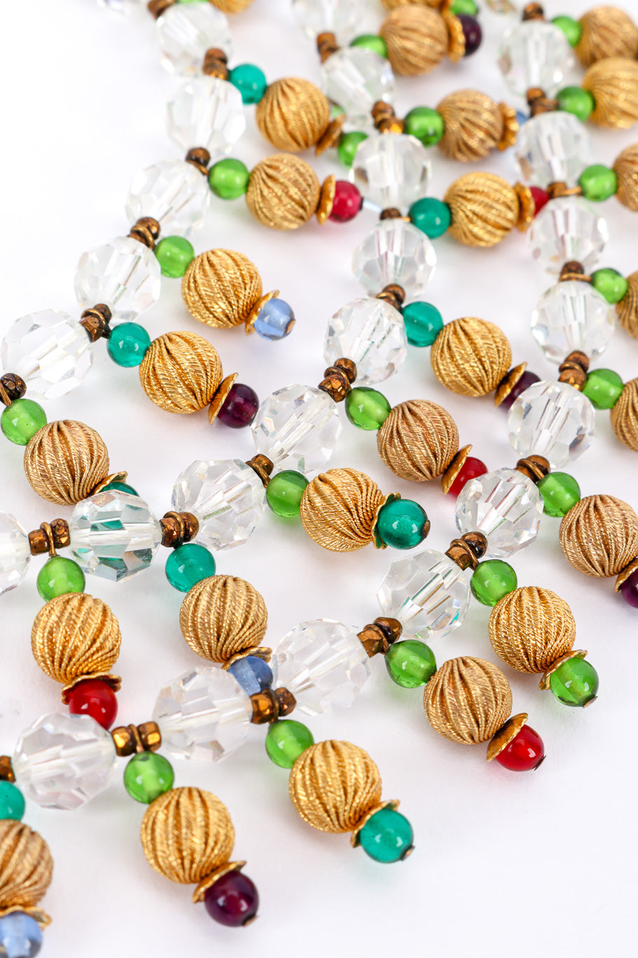 Vintage 3-Strand Beaded Necklace bead closeup on a white backdrop @Recessla