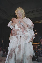 draped cherub dress by Vivienne Westwood on model with baby on 1991 runway