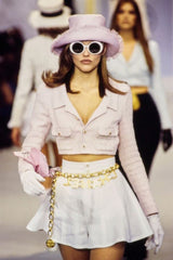 Oversize round sunglasses by Chanel on model in white on 1993 runway