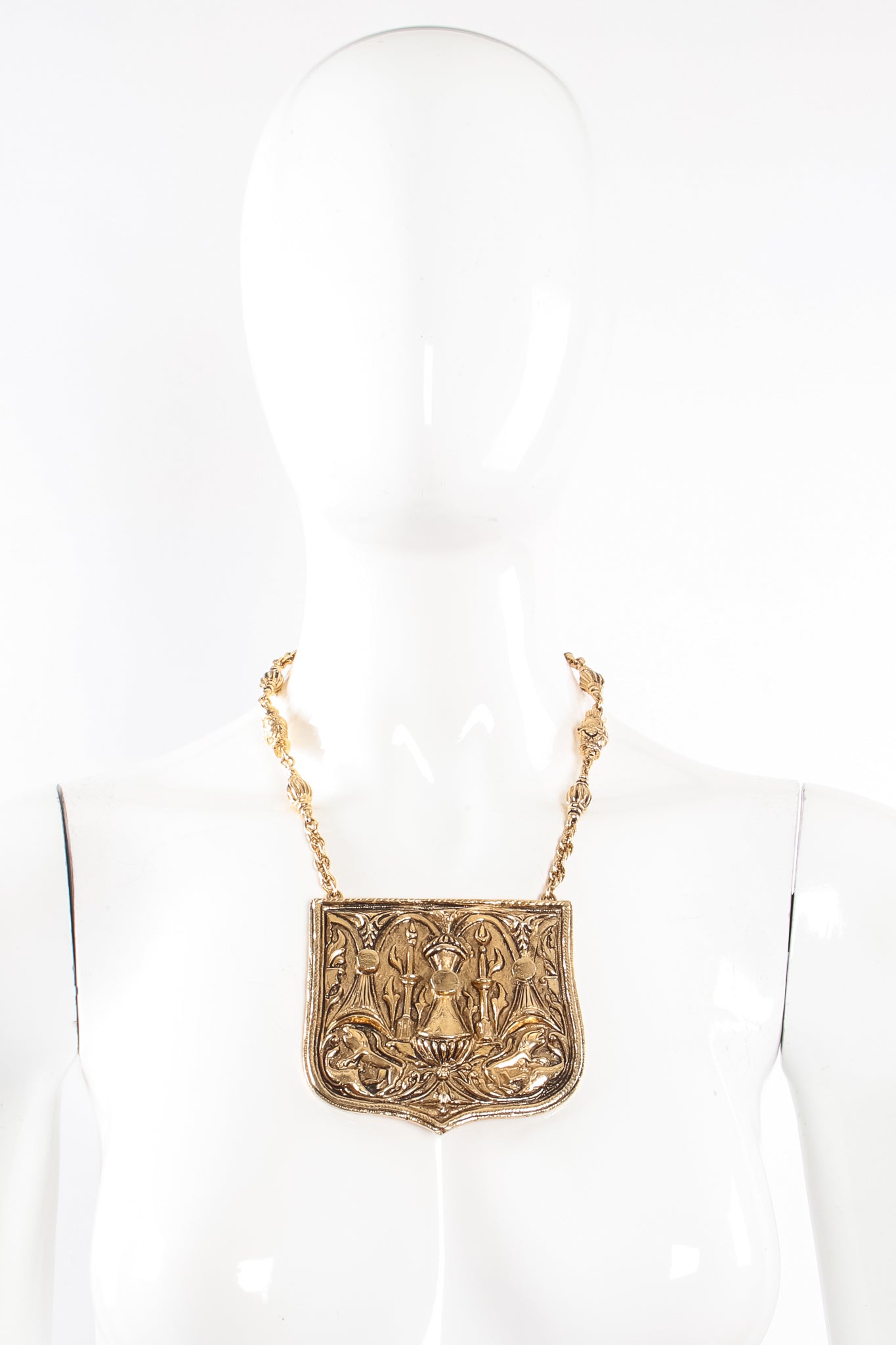 Vintage Accessocraft Brass Gothic Relief Plate Necklace on mannequin at Recess Los Angeles