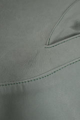 Vintage Alaia Leather Tie Peplum Jacket on Mannequin leather texture at Recess Los Angeles