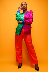 Brittany Hampton in Vintage Escada Orange Double Pleated Pant on pink at Recess Los Angeles