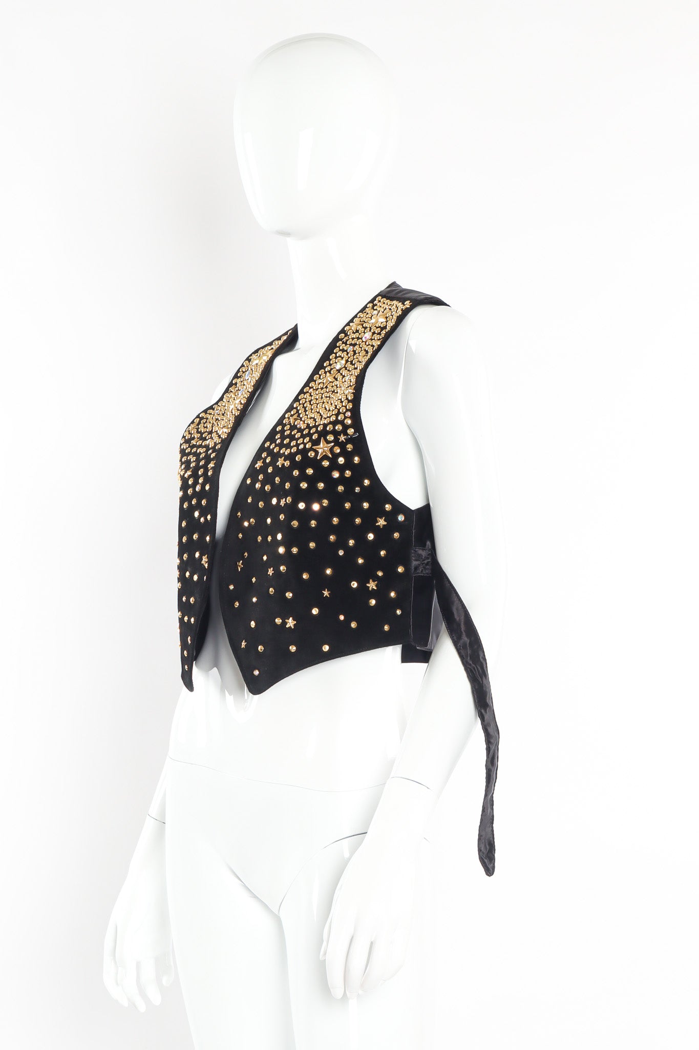 Leather vest with eclectic star and opalescent studs by K. Baumann three quarter view untied @recessla