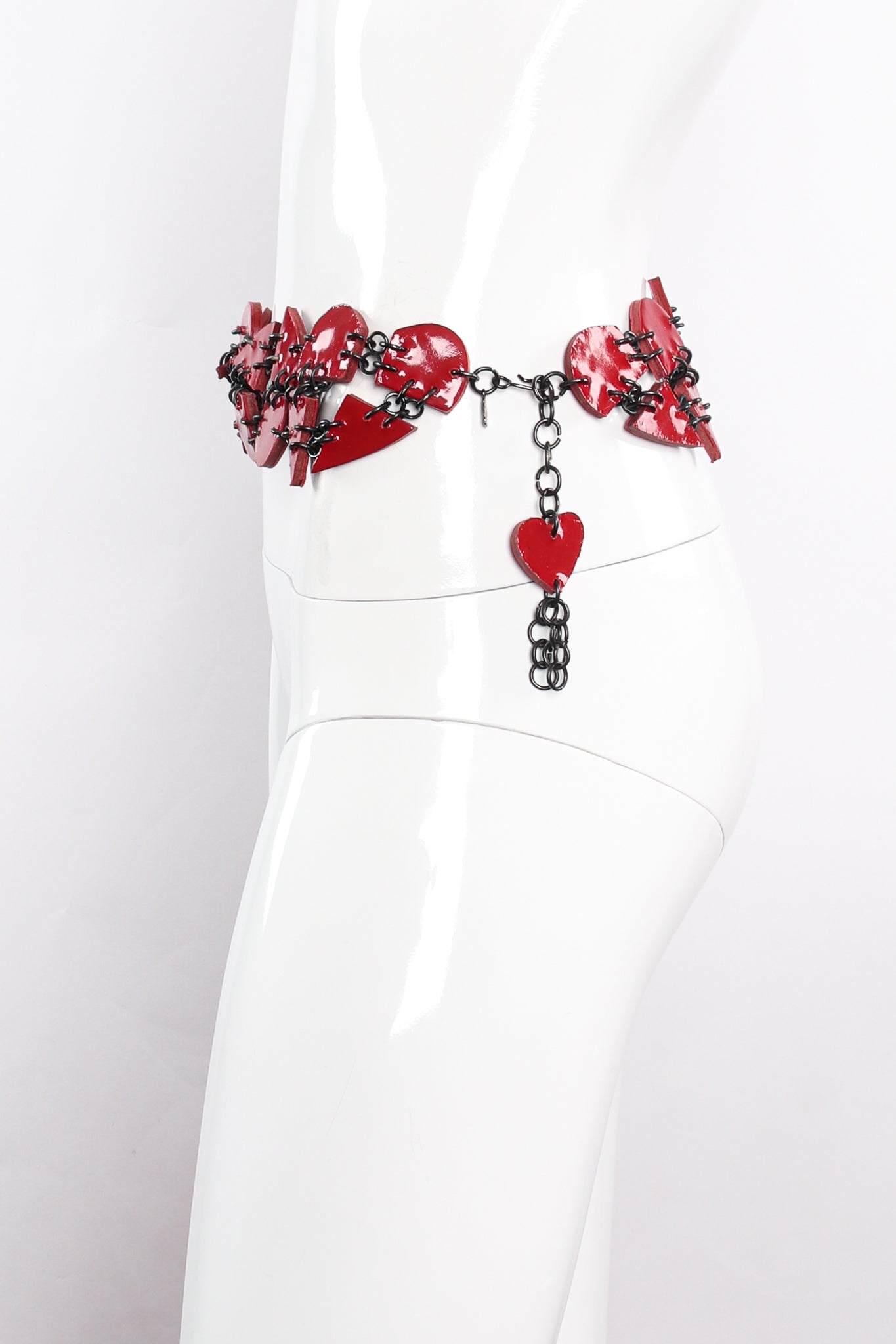Vintage Moschino Lacquered Broken Heart Chain Belt on mannequin side at Recess Los Angeles