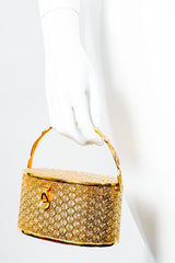 Vintage Neiman Marcus Gold Metal Floral Vanity Case Box Bag in mannequin hand at Recess Los Angeles