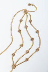 Vintage St John Gold Triple Drape Rosette Chain Belt on grey at Recess Los Angeles