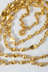 Vintage St. John Gold Faceted Diamond Rope Necklace on grey at Recess