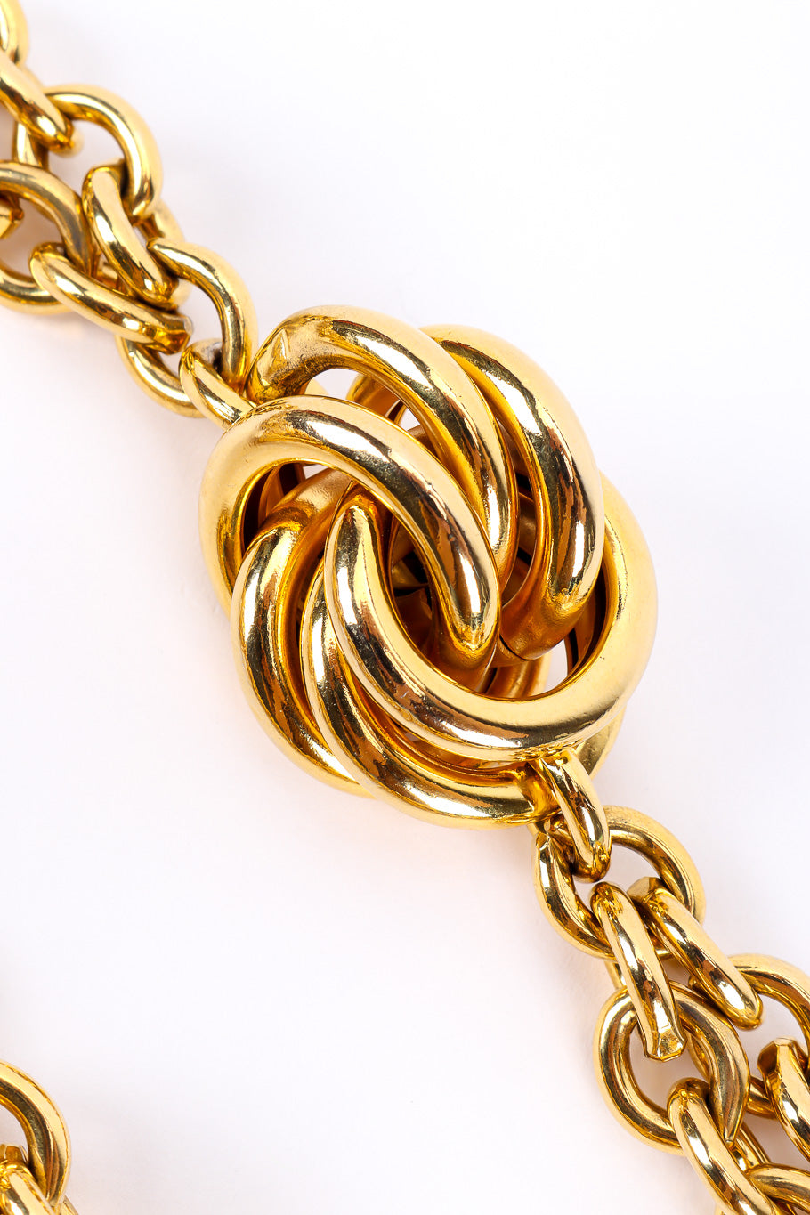 Gold metal vintage chain belt on white background cluster close @recessla