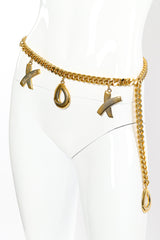 XOXO charm belt by Paloma Picasso on white background on mannequin @recessla