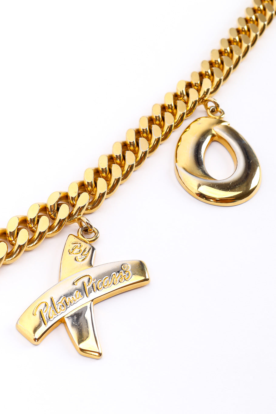 XOXO charm belt by Paloma Picasso on white background X and O charms close @recessla