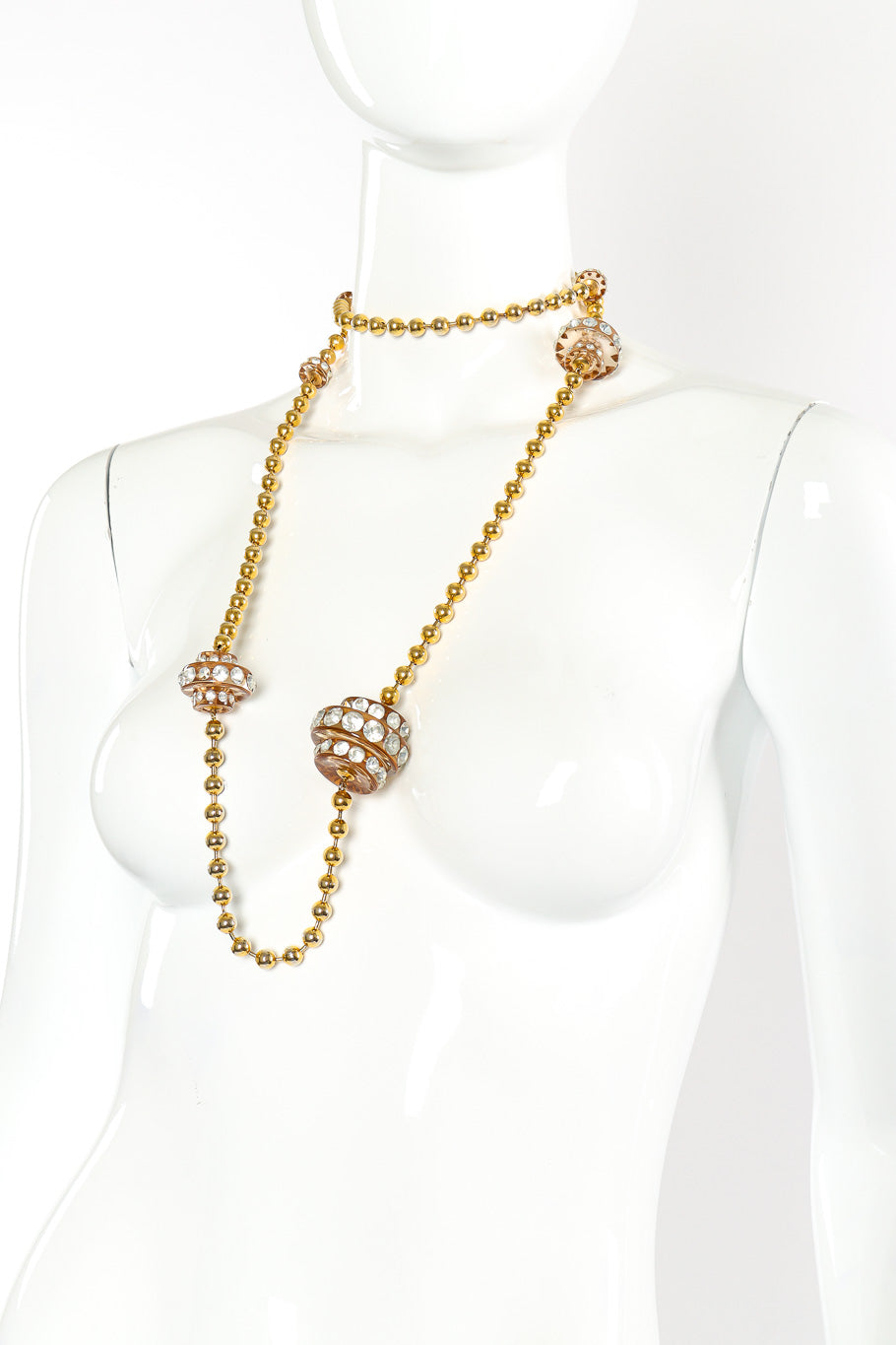 Vintage lucite disc necklace on white background looped around mannequin neck twice @recessla