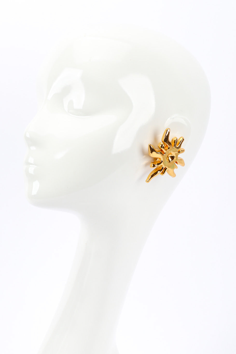 Sunburst earrings by Christian Lacroix on white background on mannequin head @recessla