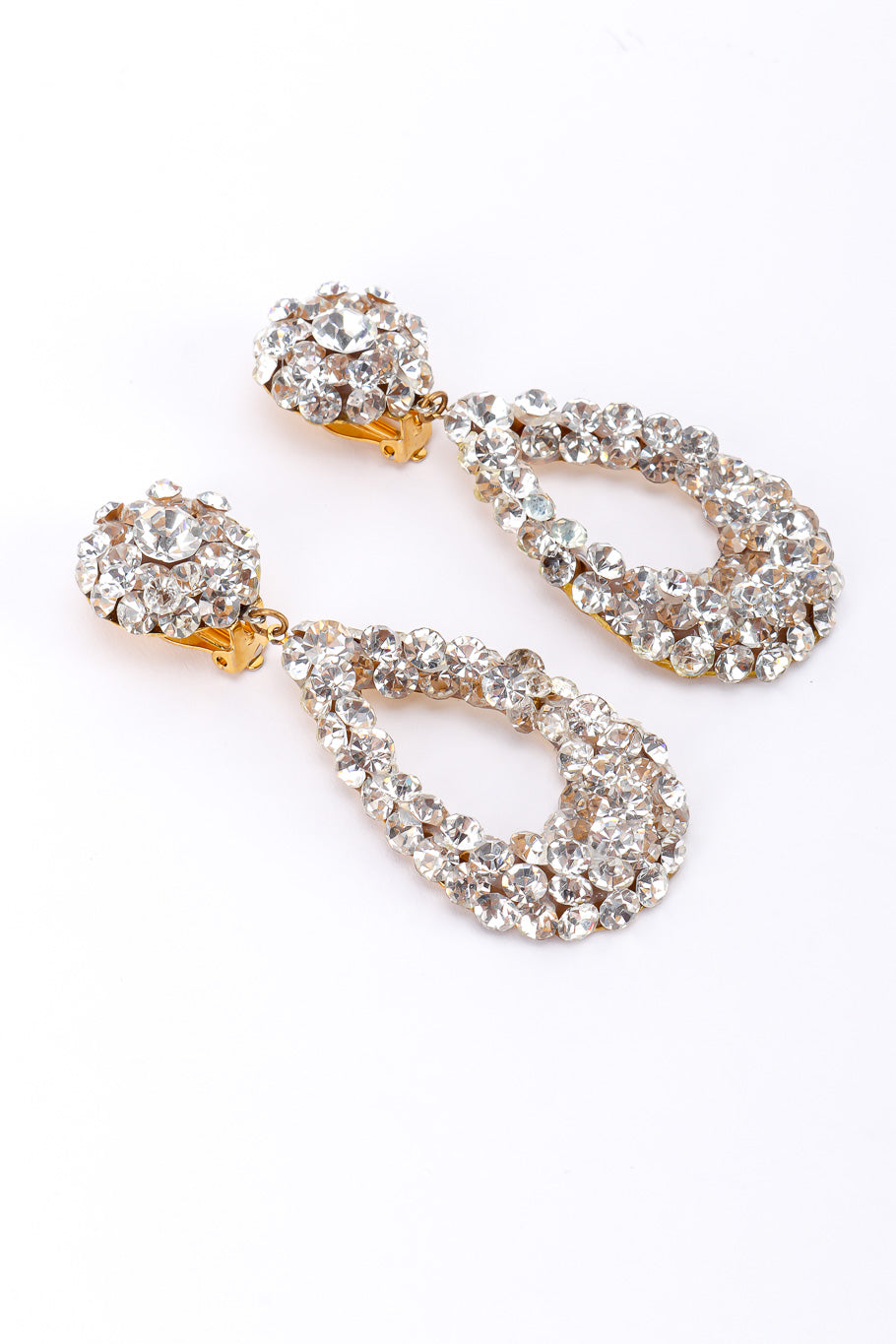 Vintage rhinestone tear-drop earrings on white background sideways @recessla