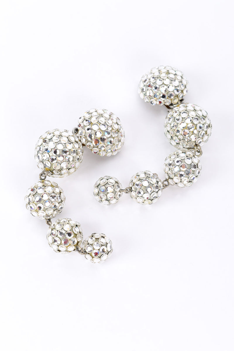 Ball drop earrings by Richard Kerr on white background in arches @recessla