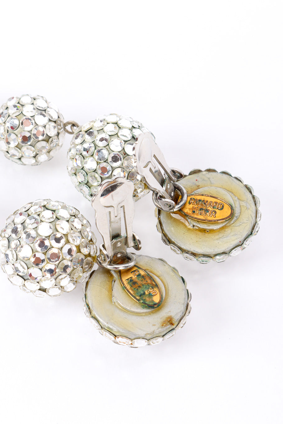 Ball drop earrings by Richard Kerr on white background cartouches @recessla