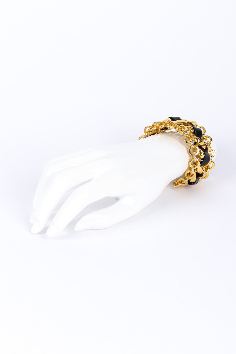 Vintage woven leather chain cuff on white background on mannequin hand @recessla
