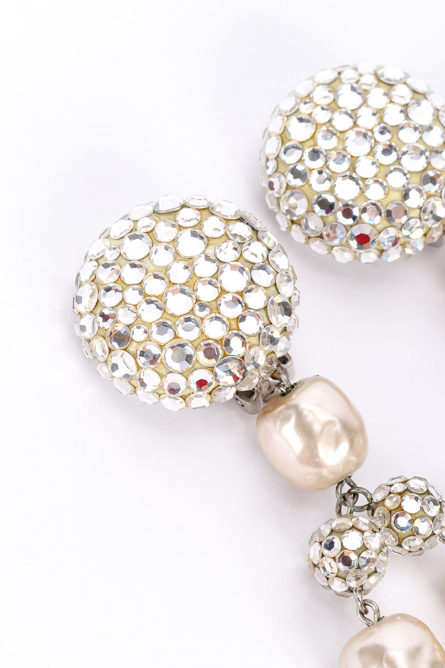 Pearl drop earrings by James Arpad on white background tops @recessla