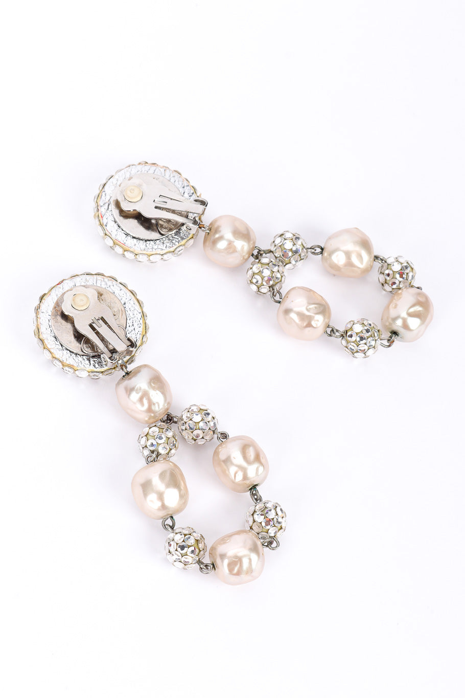 Pearl drop earrings by James Arpad on white background backs @recessla
