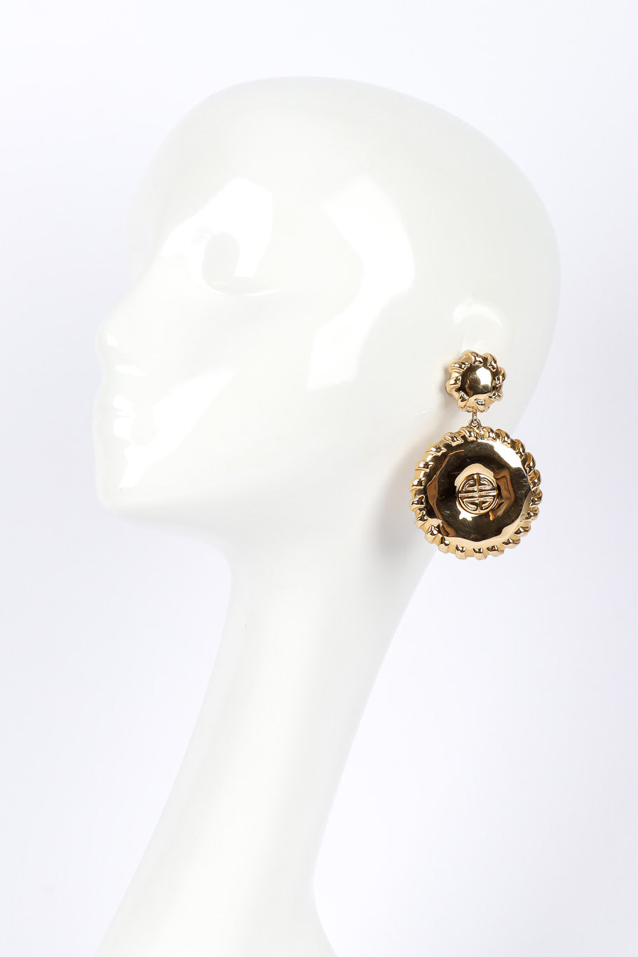 Medallion drop earrings by Givenchy on white background on mannequin head @recessla