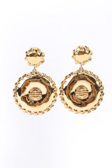 Medallion drop earrings by Givenchy on white background side by side @recessla