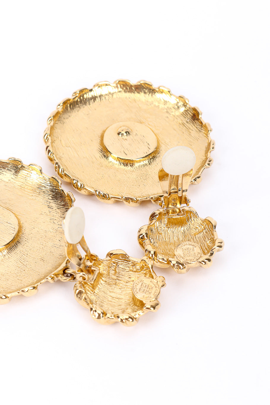 Medallion drop earrings by Givenchy on white background backs open @recessla