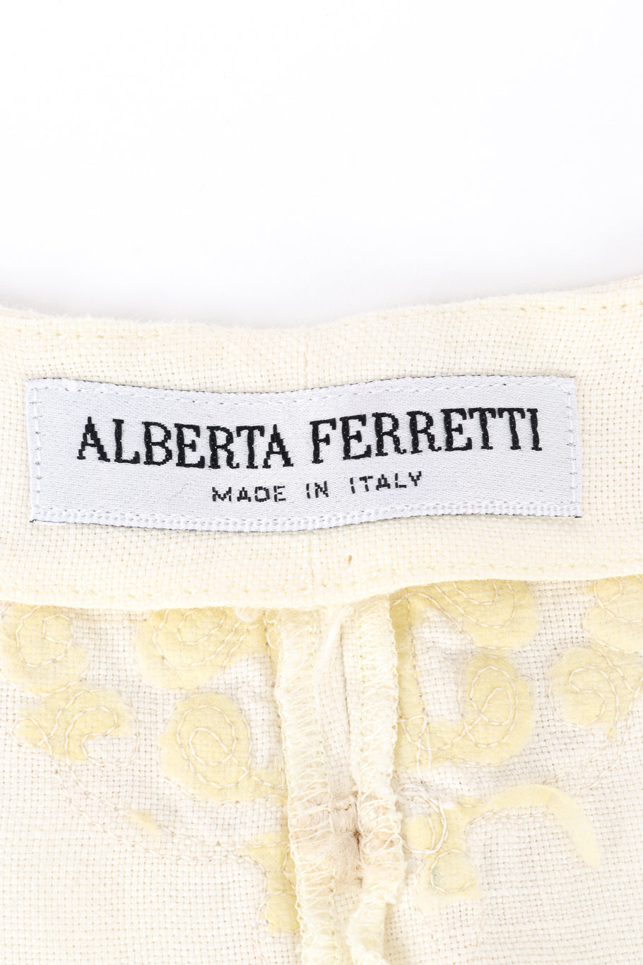 Vintage Alberta Ferretti woven linen embroidered cream mock tunic vest and pant twin set  close up on the makers label found inside the mock tunic vest  @Recess LA