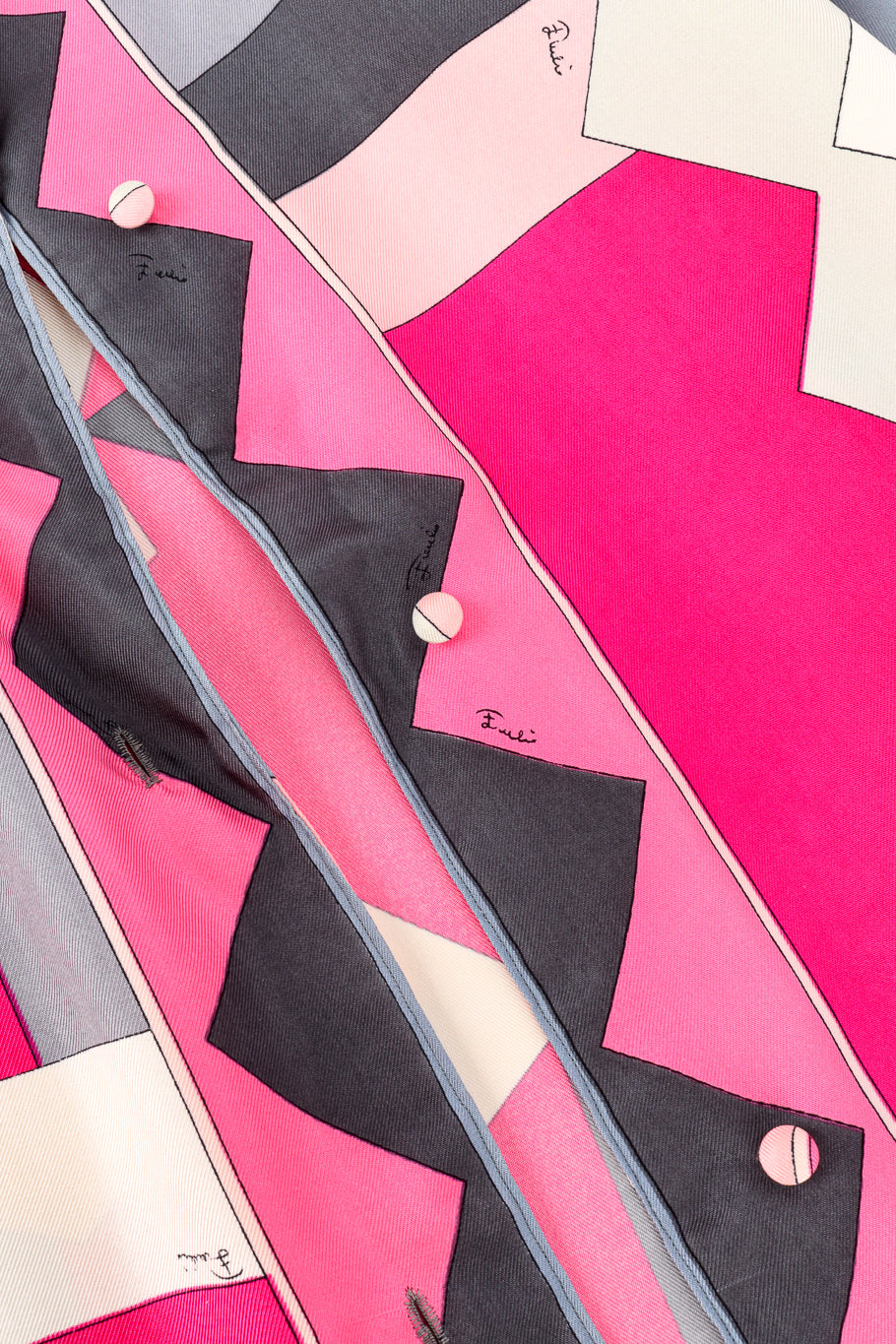 Vintage Emilio Pucci geometric pink patterned blouse close up detail of the graphic print and fabric buttons @Recess LA
