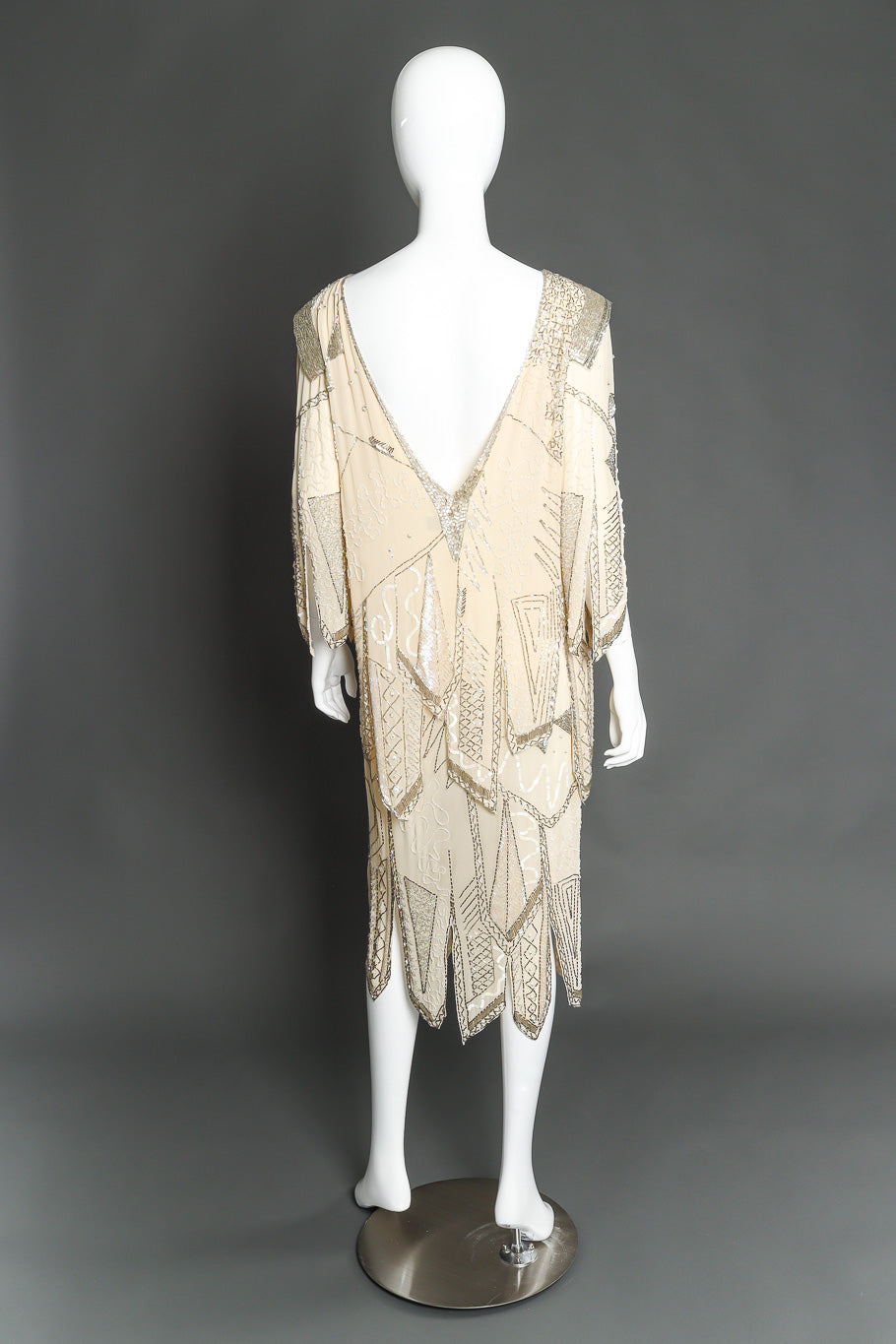 Embellished silk dress by Fabrice on mannequin back @recessla